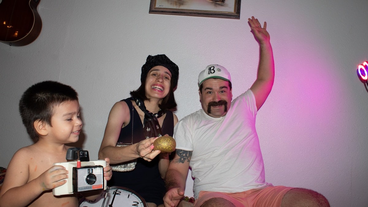 man in white crew neck t-shirt beside woman in black tank top